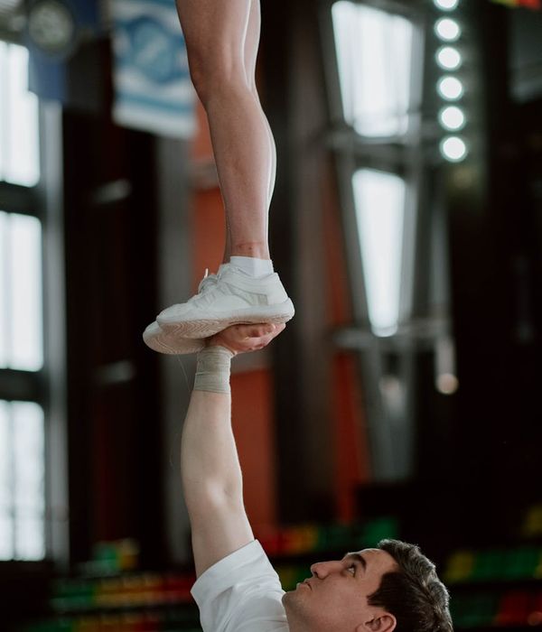 Man performing a controlled strength exercise with focus.
